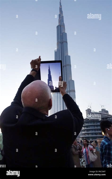 Dubai United Arab Emirates Man Photographs The Burj Khalifa With His