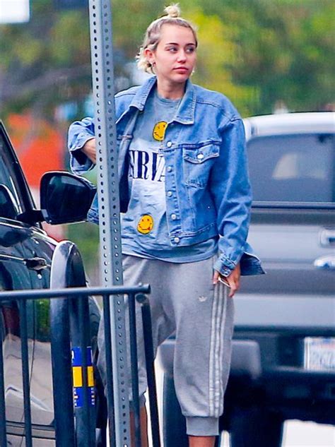 Miley Cyrus Rocks An Oversized Denim Jacket And Trackie Bottoms For A