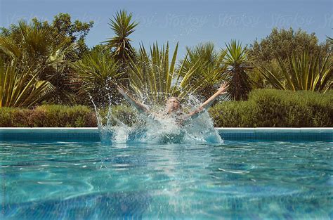 Boy Enjoys Swimming In The Pool By Stocksy Contributor Marija Anicic Stocksy