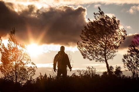 Adventurous Man Observing A Lovely Sunset In Nature Alone Stan Stock