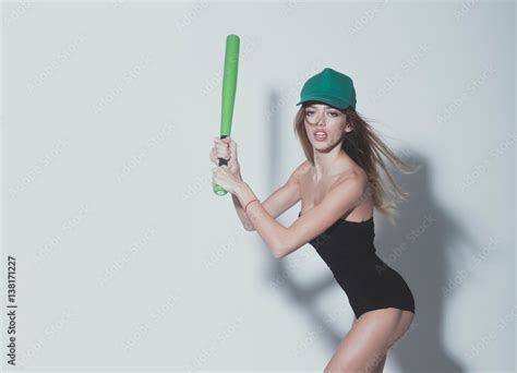 Pretty Sexy Woman With Long Hair Holds Green Baseball Bat Stock Foto Adobe Stock