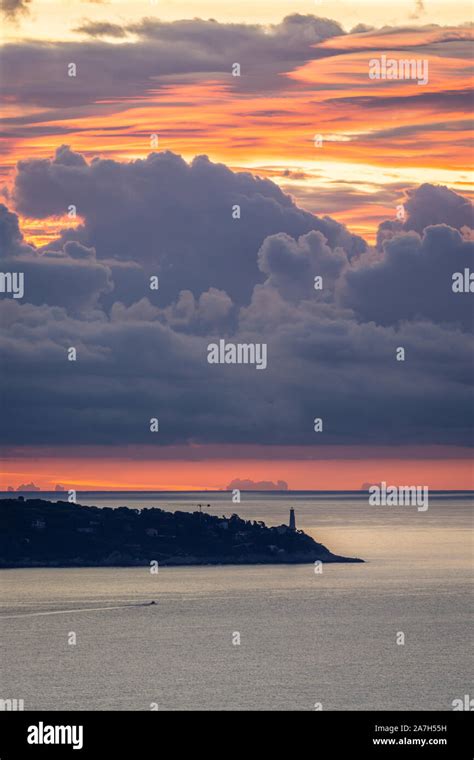 Lighthouse With A Dramatic Cloudy Sunrise Stock Photo Alamy