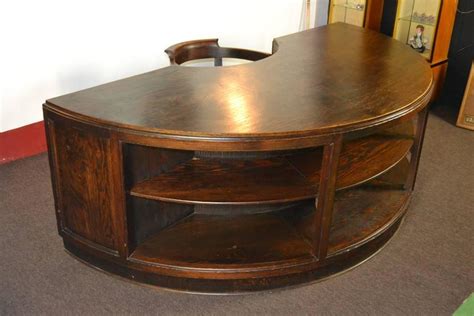 The uplift half circle desk drawer is an easy way to store small desk items and keep your desktop clear of excess clutter. Antique Half Round Wooden Executive Desk For Sale at 1stdibs