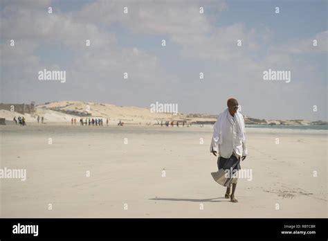 A Somali Man Talks A Walk Down Lido Beach On December 21 In Mogadishu
