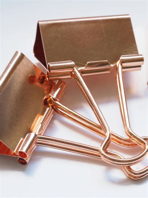 Two Gold Binder Clips · Free Stock Photo