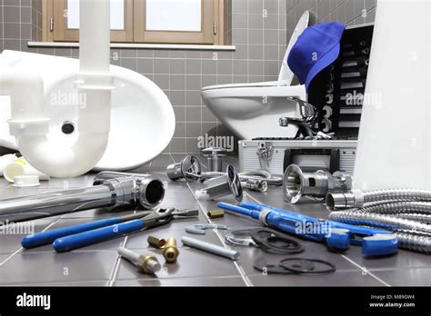 Plumber Tools And Equipment In A Bathroom Plumbing Repair Service