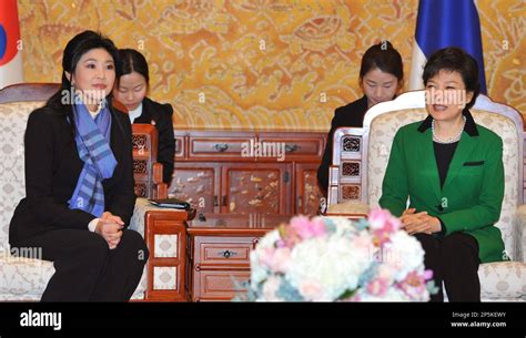 south korea s new president park geun hye right talks with thai prime minister yingluck