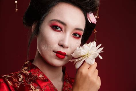 Image Of Beautiful Geisha Woman In Japanese Kimono Holding Flower Stock Image Image Of Exotic