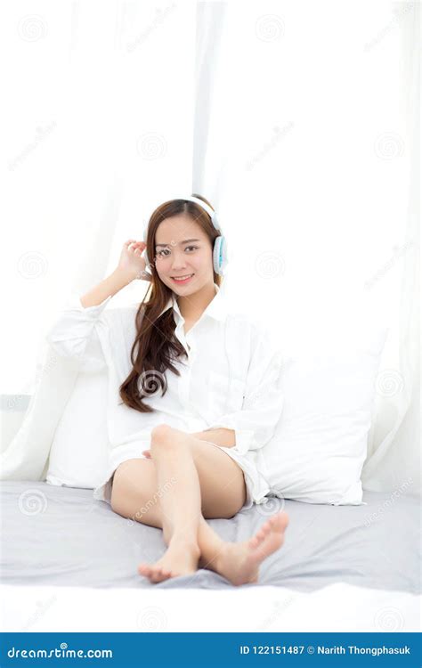 Beautiful Asian Young Woman Enjoy Listen Music With Headphone While