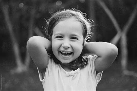 Portrait Of A Cute Young Girl Laughing By Jakob Lagerstedt