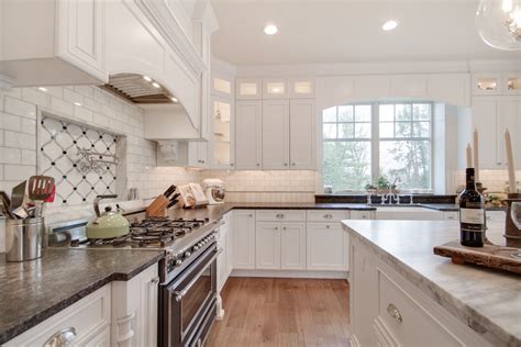 This Bright White Kitchen Features A Mont Blanc Honed Quartzite Island