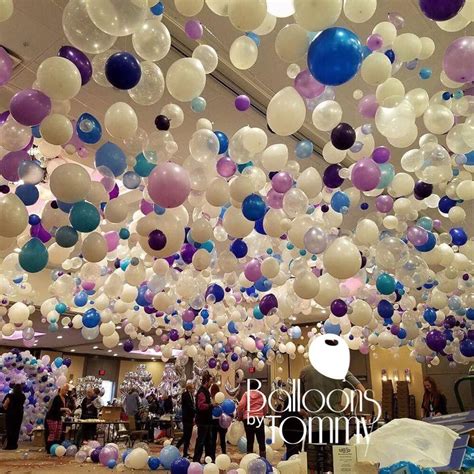 This Ceiling Is Covered In White Blue And Purple Balloons This Type