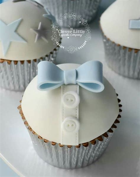 There are many cute theme ideas represented on these dessert and food tables so take a tour and be inspired to bake (or order!) cakes, cupcakes and more! Boy cupcake christening baby shower bow tie buttons blue ...
