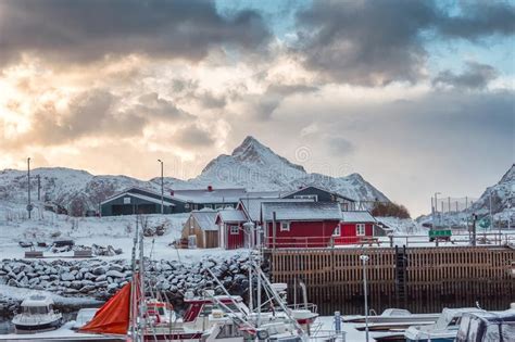 Scandinavian Village With Fishing Boat And Snow Mountain In Coastline