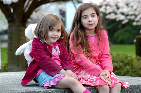 Free Two Girls With An Oleander Photos And Pictures Freeimages
