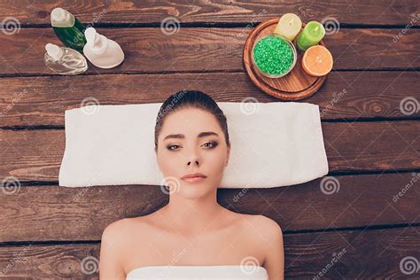 Top View Photo Of Attractive Young Girl Relaxing In Spa Salon With Spa Cosmetics Stock Image
