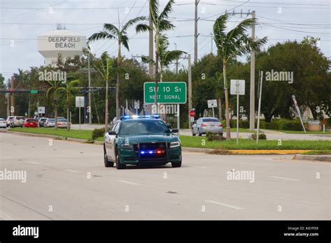 Broward County Sheriff Car with Its Lights Flashing Speeds By En Route