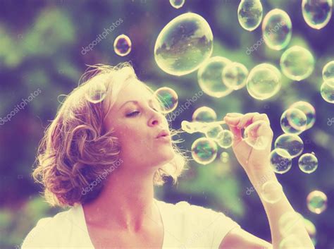 Beautiful Woman Blowing Bubbles Stock Photo Graphicphoto