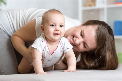 Funny Crawling Baby Girl With Mom — Stock Photo © Oksun70 99532166