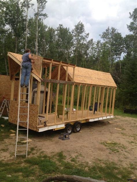 Great Pictures Of A Couple Building Their Own Tiny House Using A Boat