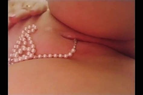 Pulling A String Of Pearls Out Of Stuffed Shaved Pussy