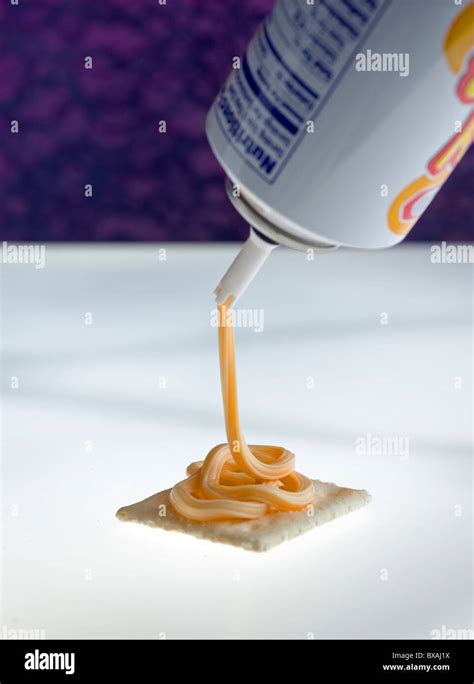 A Conceptual View Of Canned Spray Cheese And Crackers Stock Photo Alamy
