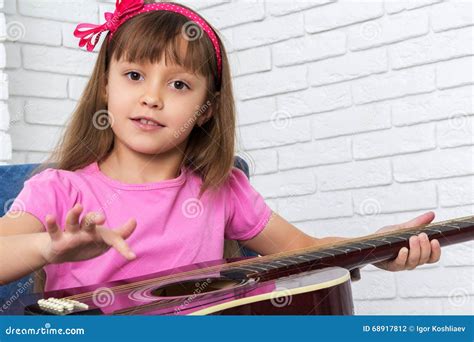 Little Girl Playing The Guitar Stock Photo Image Of Instrument