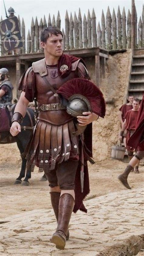 Men Dressed In Roman Armor Walking On Dirt