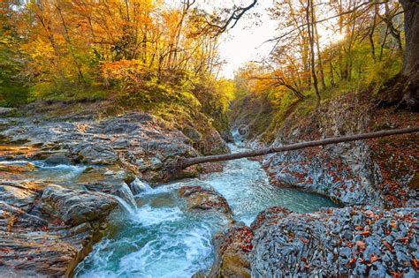 Beautiful Waterfall In Forest At Sunset Autumn Landscape