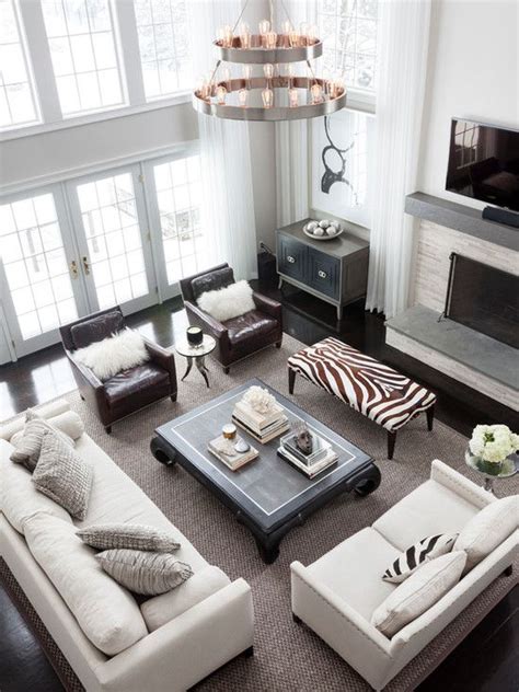 Flipping through magazines and internet images i noticed that a common living room furniture arrangement for smaller sized living rooms consists of a sofa plus two chairs, usually at an angle, like this one below: Two story living room with floor to ceiling windows ...