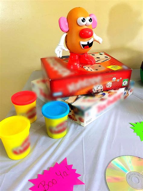 A Table Topped With Lots Of Toys On Top Of A White Table Cloth