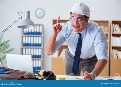 The Engineer Supervisor Working On Drawings In The Office Stock Photo