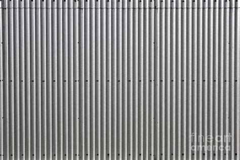 Metal cow sculpture is made of random pieces of scrap metal and shovels by a poor man's bronze artist. Corrugated Galvanized Steel Wall Photograph by Leslie Banks