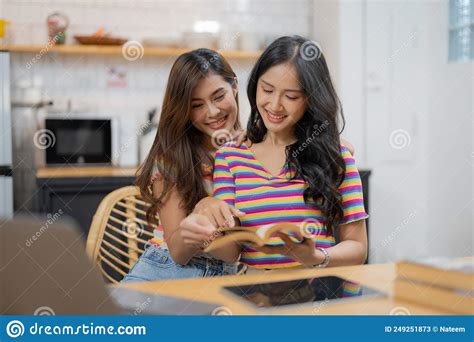 Happy Lesbian Lgbtq Couple In Love Cuddling Laughing Having Fun At