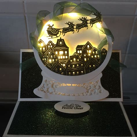 Tattered Lace Snow Globe With Bright Lights Some Glitter Card And Ribbon