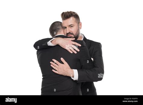 Homosexual Couple Of Grooms In Suits Hugging Isolated On White Stock