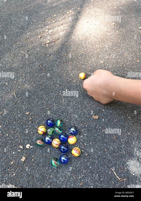Boy Playing Marbles High Resolution Stock Photography And Images Alamy