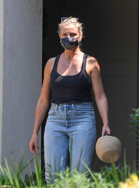 Cameron Diaz Looks Relaxed In A Black Vest And High Slung Jeans Daily