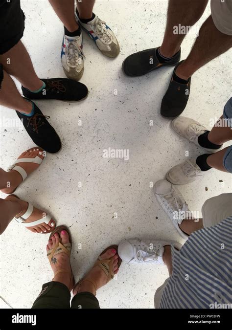 Seven Pairs Of Feet In A Circle Stock Photo Alamy