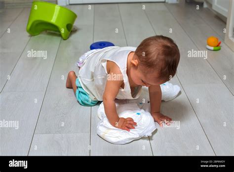 Potty Training Concept A Cute Little Baby In A Room On The Bright