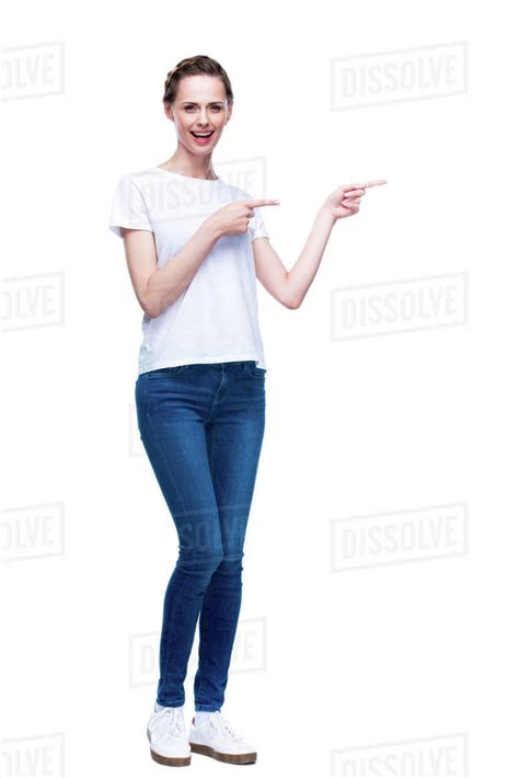 Attractive Woman In White T Shirt Pointing Somewhere Isolated On White