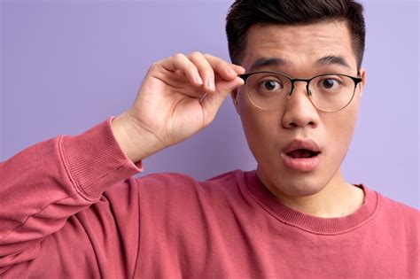 Premium Photo Shocked Nice Chinese Male In Eyeglasses Emotionally