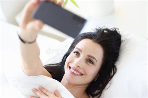 Young Woman Lying In Bed And Taking Selfie Stock Image Image Of Lying Healthy 212391737