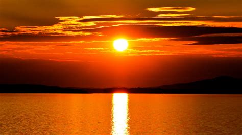 Download Wallpaper 1366x768 Sunset Sun Horizon Lens Flare Tablet
