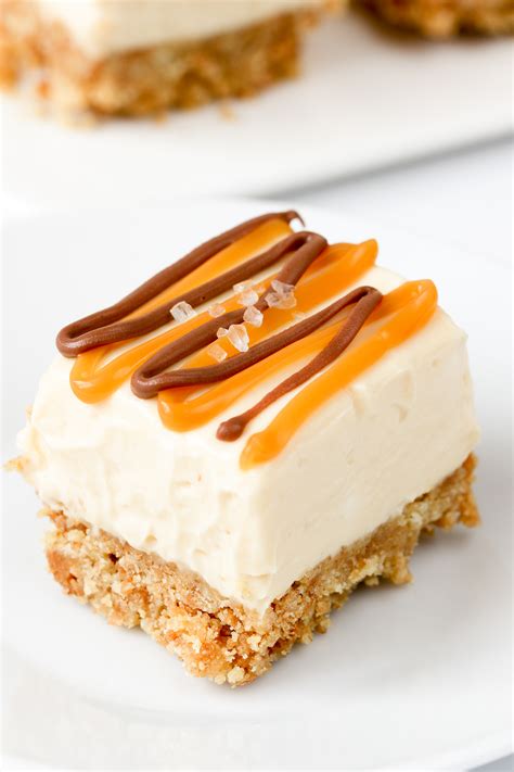 Rich creamy cheesecake is smothered in sweet milky caramel and topped with crunchy chocolate toffee. Salted Caramel Cheesecake Bars Recipe