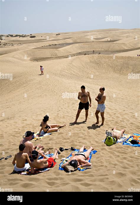 People Sunbathing In Dunes Maspalomas Gran Canaria Spain Stock Photo
