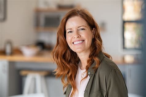 Portrait Of Smiling Mature Woman Looking At Camera With Big Grin