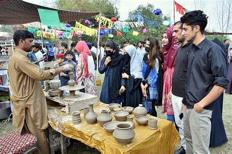 Students Are Visiting Different Cultural Stalls During Gur Mela At The