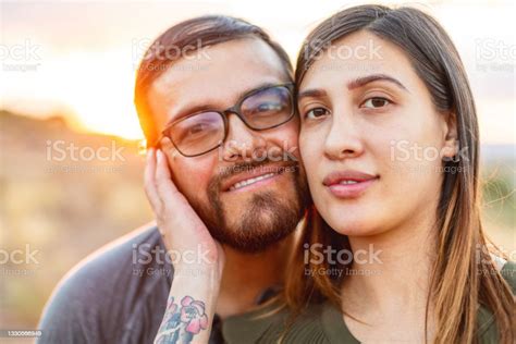 Hispanic Husband And Wife Close Up Head Shots Maternity Photo Series