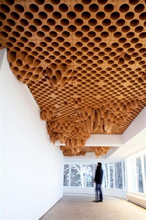 Honeycomb paper ceiling® is a succession of honeycomb paper cells to mask any upper views of the exhibition halls. honeycomb ceiling | architecture and space | Pinterest